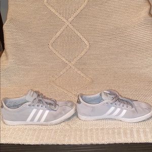 Gray and white Adidas shoes